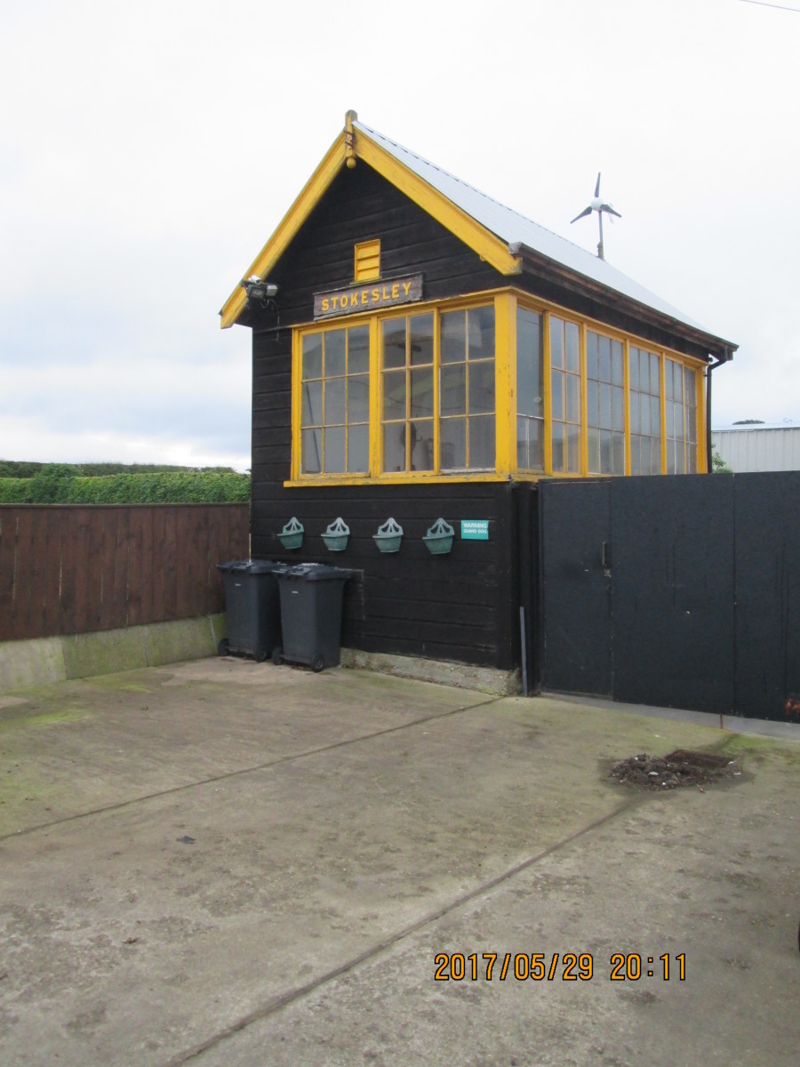 The signal cabin was 'shunted' away from its original site away from the platform to a site across the road - and the woodwork painted a golden yellow