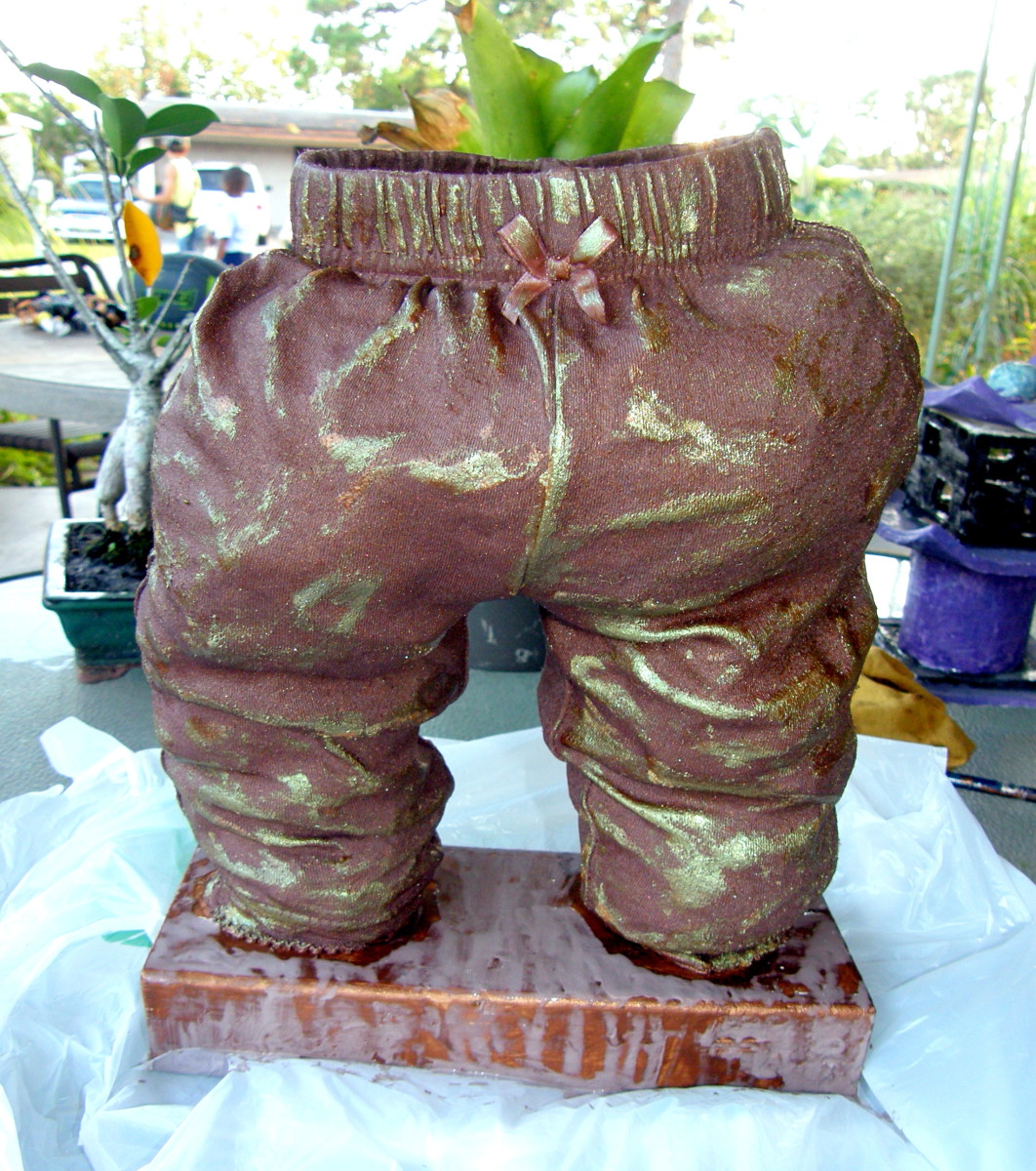 My grand-daughter out-grew this pair of pants, so I decided to create a sculpture with it using Paverpol.  It is now like bronze, and can even be used as a planter.