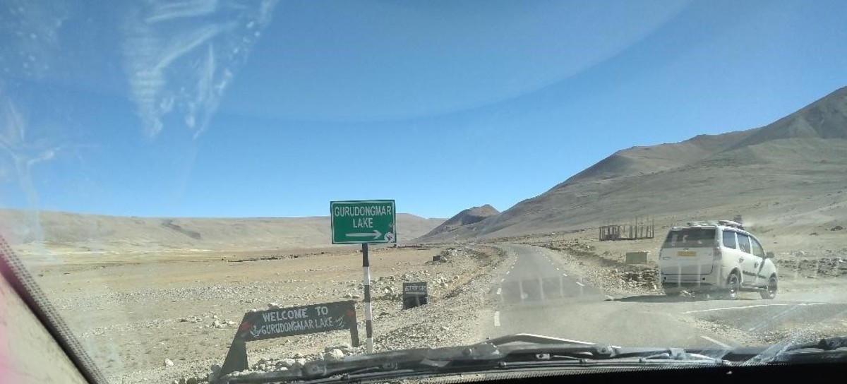 en-route-gurudongmar-lake-lonely-roads-arid-terrain-snow-clad-mountains-yaks-and-us-an-exhilarating-experience