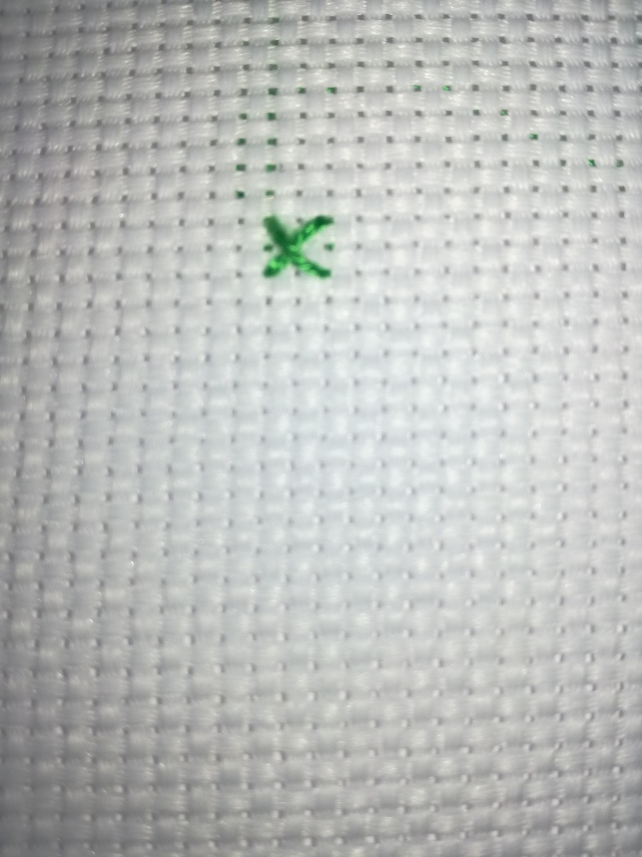 Image 10. The droopy top arm of this stitch is the result of thread laying towards the bottom while stitching.