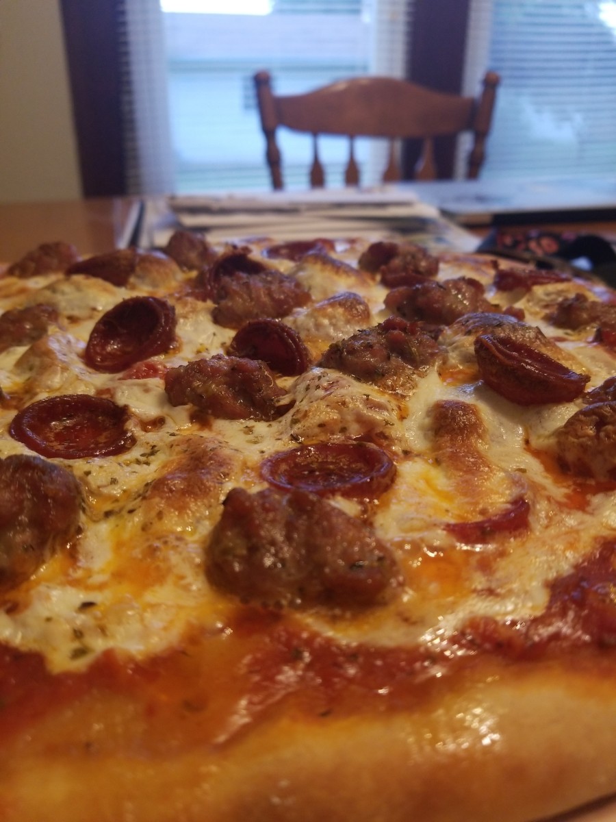 This pizza has crisp, curled, greasy pepperonis, good meaty sausage, creamy delicious cheese, and robust and flavorful sauce. It is a must try!