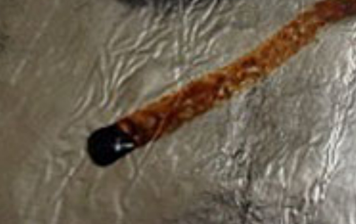 The marks (long thin 'black' streak) remains on silver foil/aluminium from "chasing the dragon".