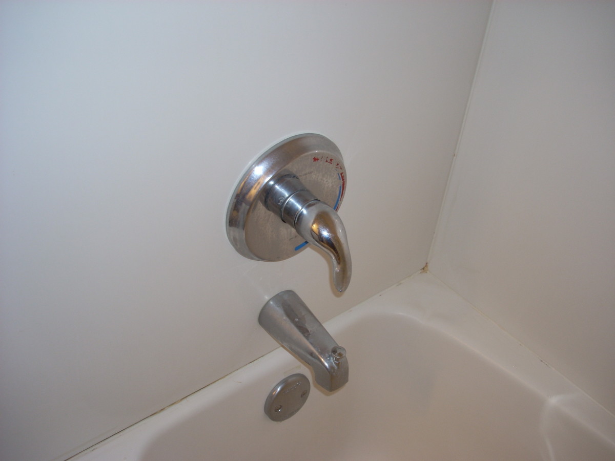 Replace your old, leaky tub faucet with a new one.