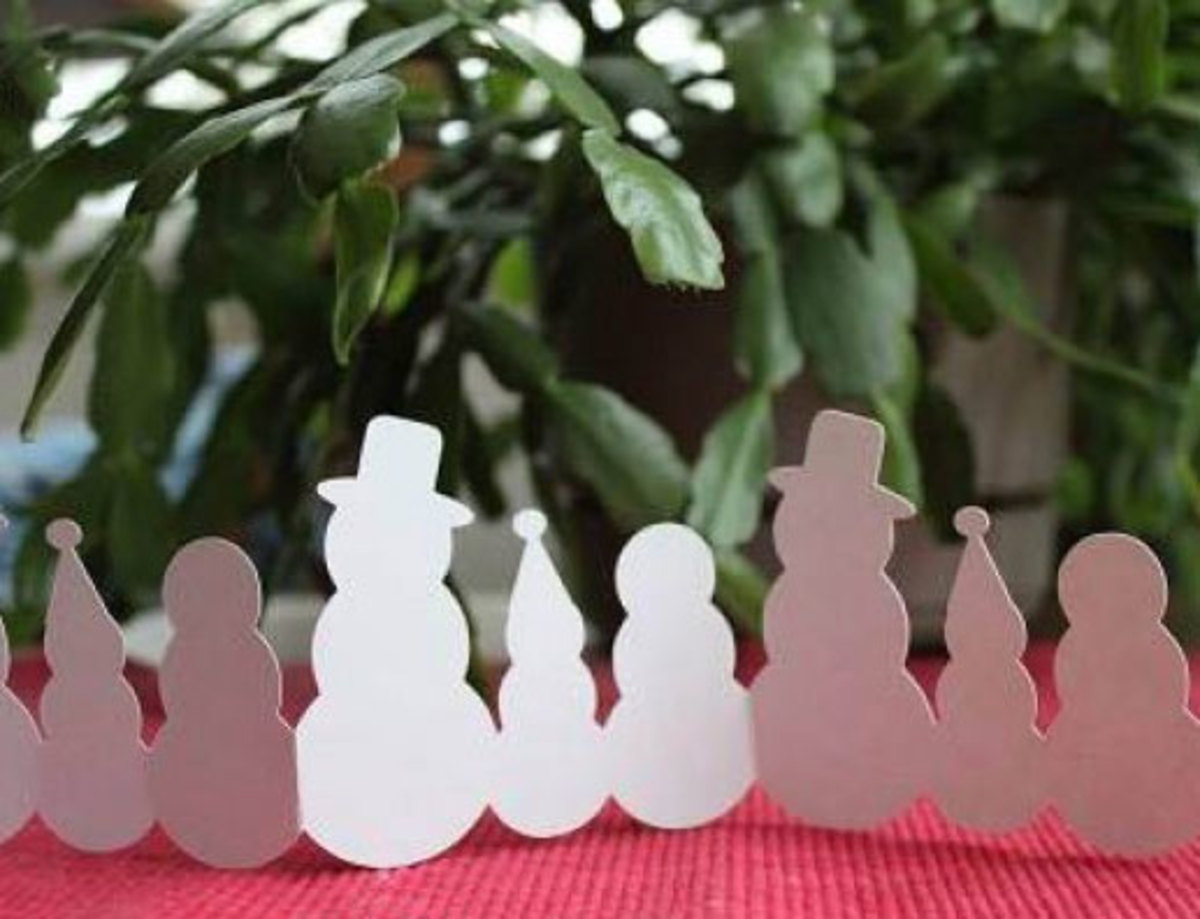 Die cut snowman family garland or windowsill decoration, made with my Silhouette cutter
