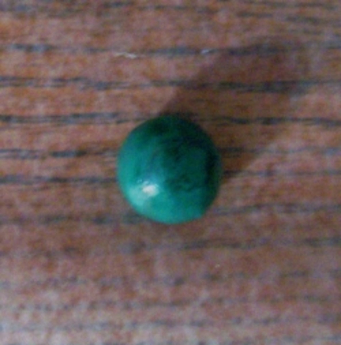 Step 3. Make a small round green ball.