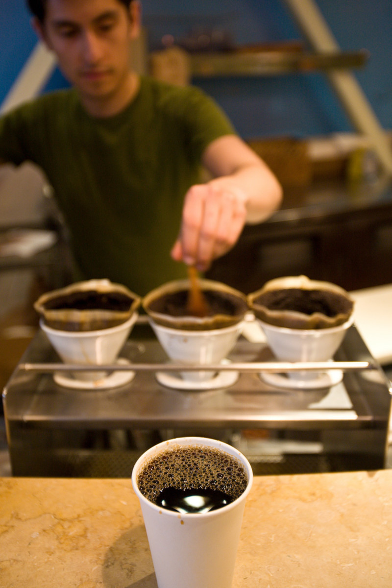 Single-serve coffee at San Francisco's Blue Bottle Coffee Company, using coffee drippers, unbleached filters, and a simple wooden stick.