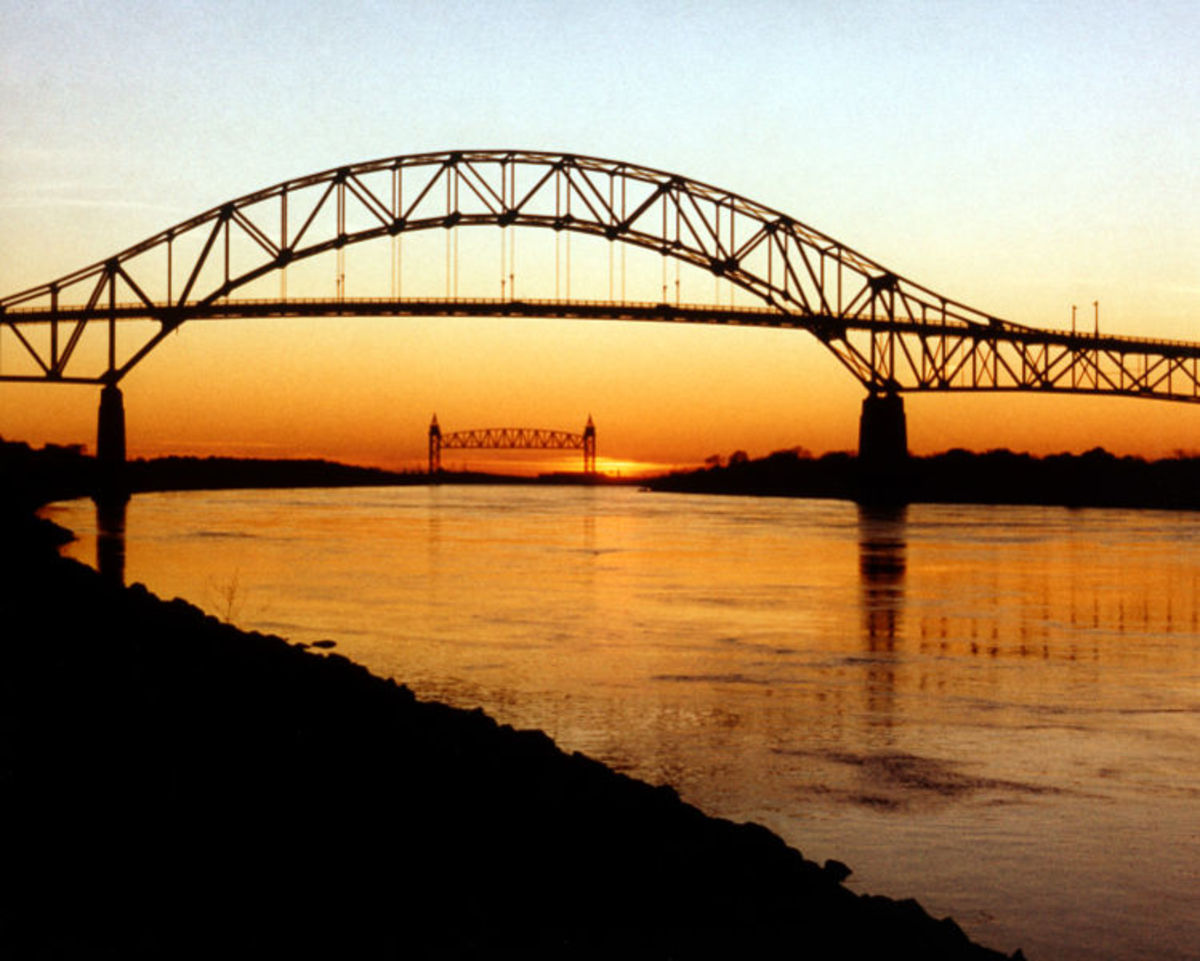 Bourne Bridge in the foreground, with the Cape Cod Canal Railroad Bridge in the background. Located near the town of Bourne in Barnstable County, MA, these are two of the three bridges over the Cape Cod Canal.