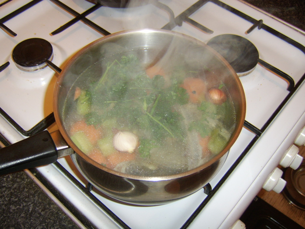 Roughly chopped parsley is added to the fish stock