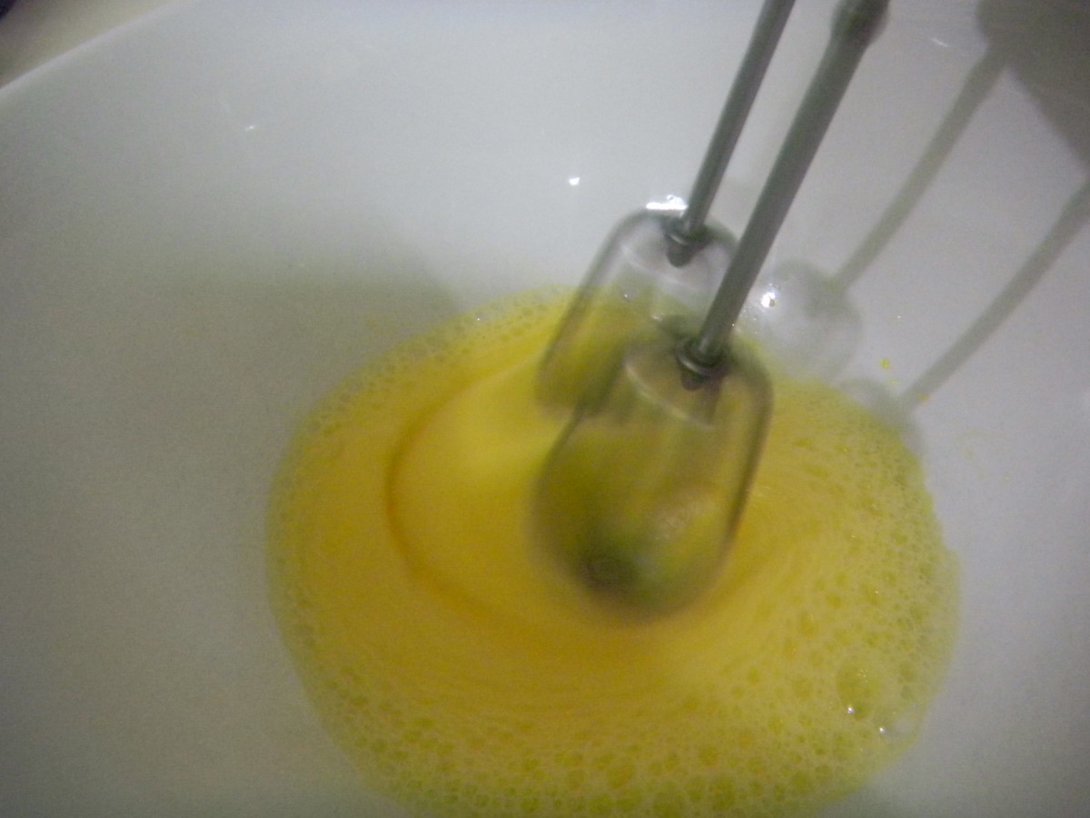 Put 2 eggs into a bowl and whisk until light and fluffy.