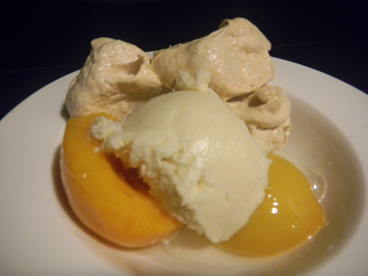 A good scoop of vanilla ice cream goes great with peaches & meringue