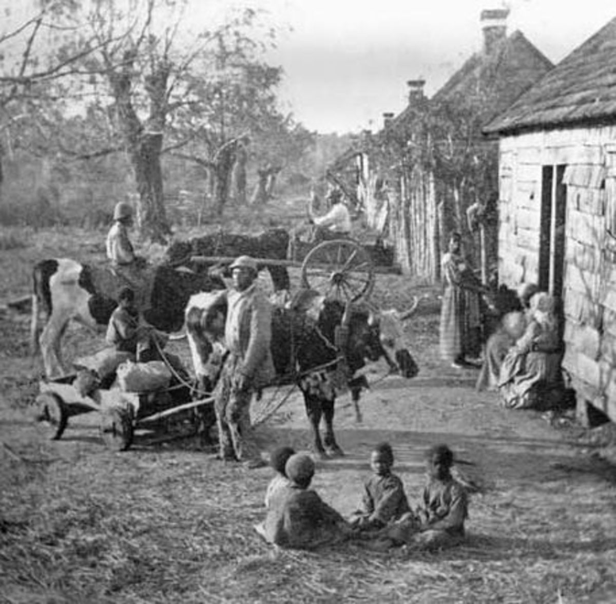 Slaves gather around their quarters at the end of the workday