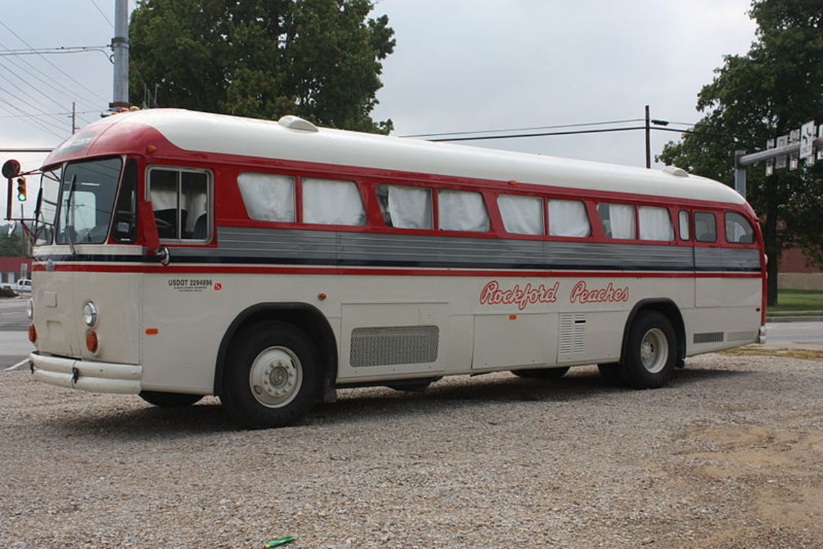 A modern bus with an art design commemorating the Rockford Peaches team. 