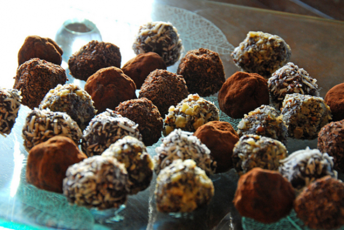 These dark chocolate truffles have been rolled in chopped toasted walnuts, cocoa, chocolate shavings or shredded coconut.