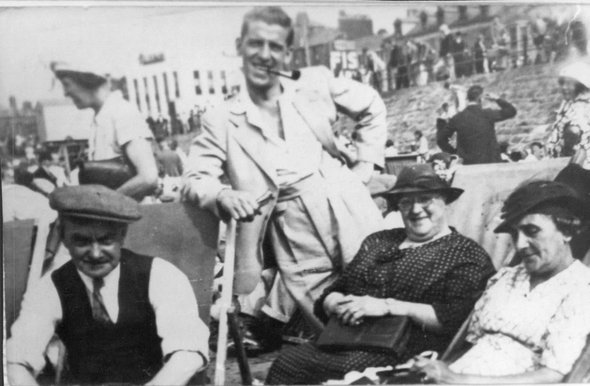 My grandad Frank Trigg on the beach in a rare photo with his own mum (on the right) and his mother and father-in-law Albert and Laura Garnham.