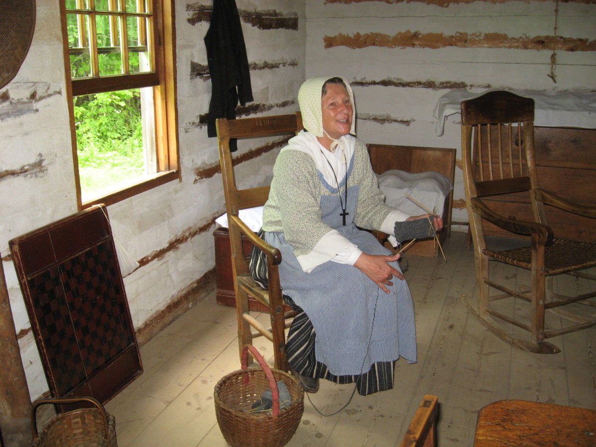 The women of the household would weave the cloth and sew the clothing for the whole family. You'll note in the photo above that she is knitting. She's wearing a very simple cap.