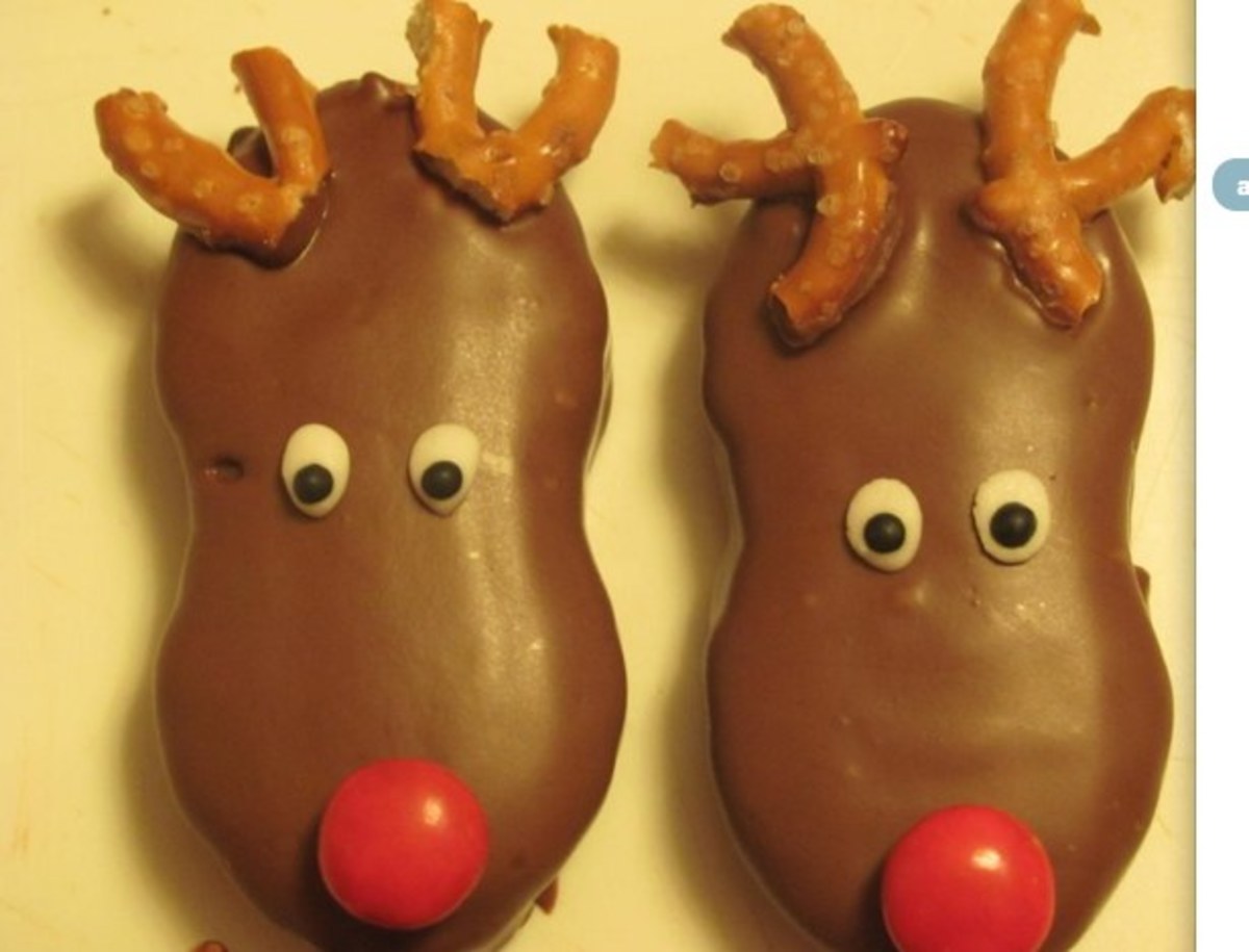 Nutter Butter reindeer cookies dipped in chocolate. Pretzel antlers.