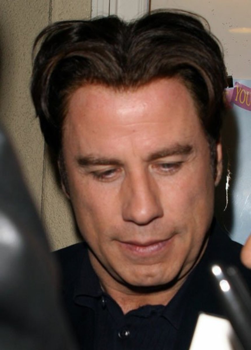 John Travolta is a big star . Does he wear a hair piece?