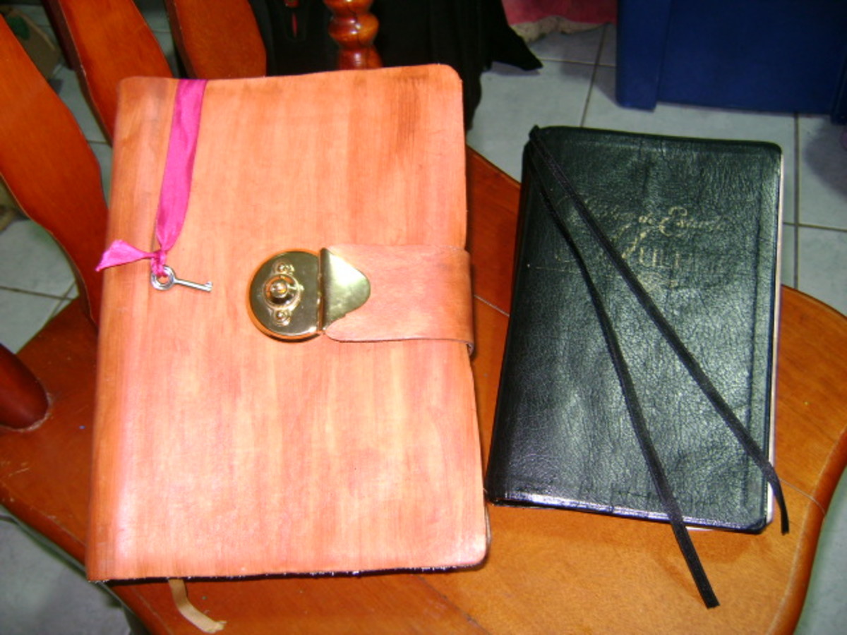 Two finished Bibles: The one on the Left is with a metal Lock and closing strap.  The one at Right is the Bible worked on in this tutorial 