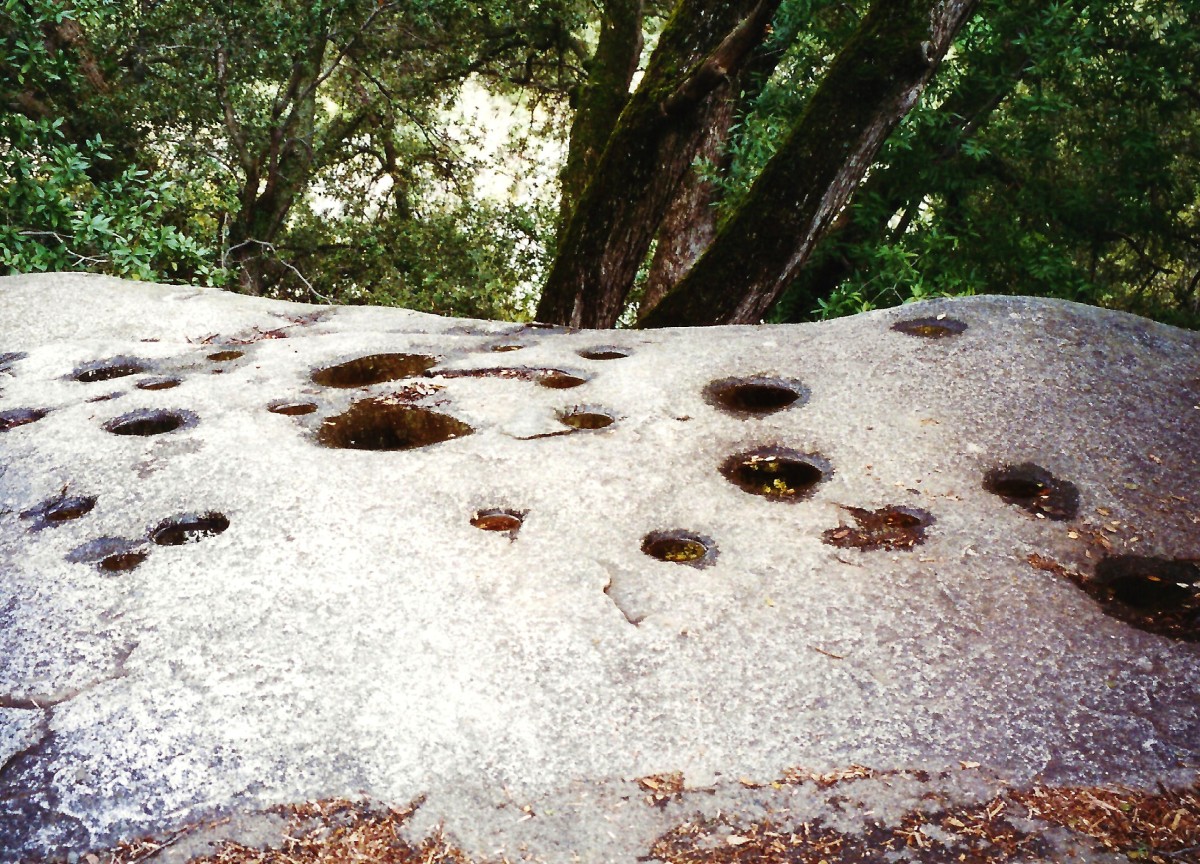 Mortar holes in the rock made by Native Americans grinding acorns 