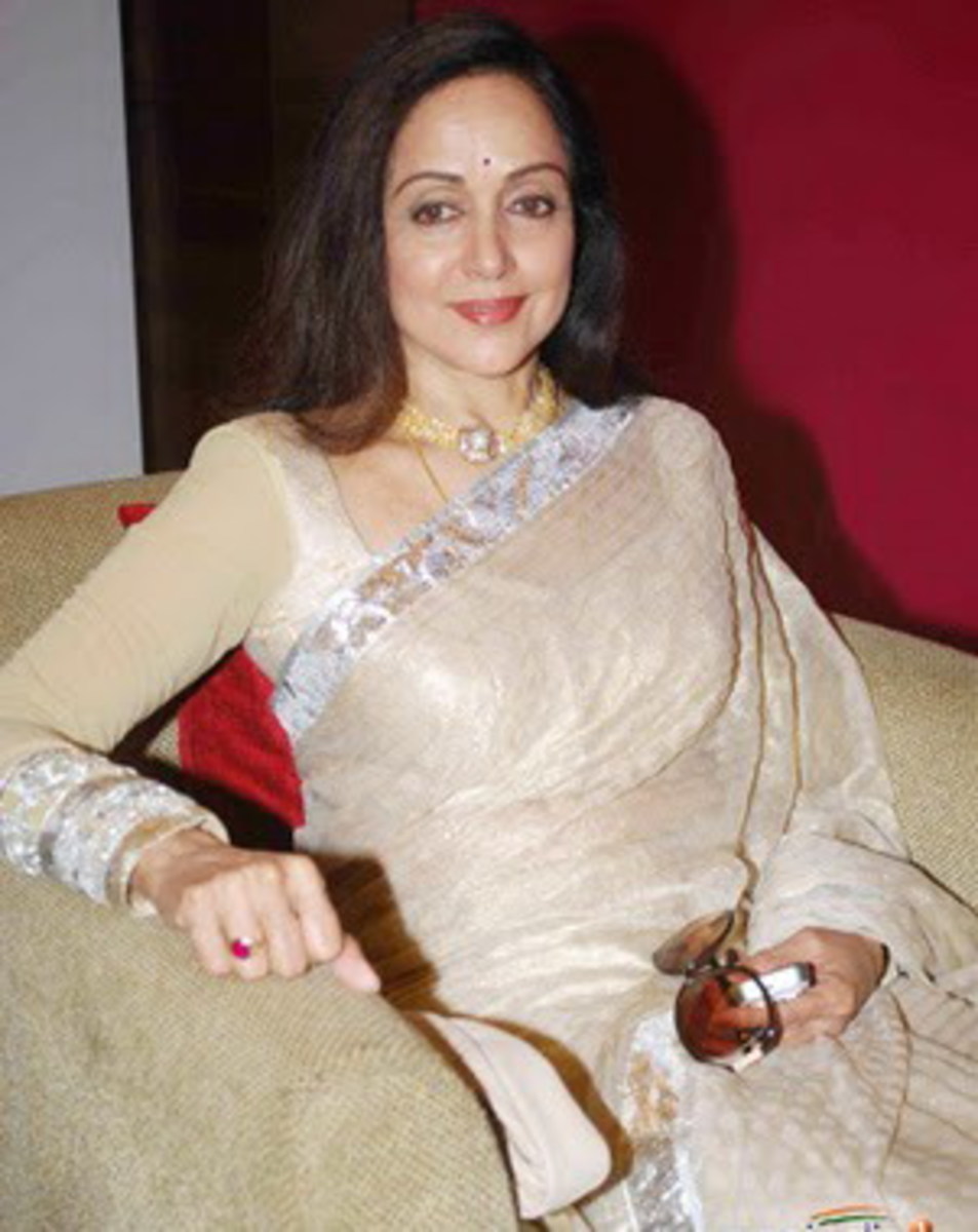 Hema in white saree and full sleeve blouse