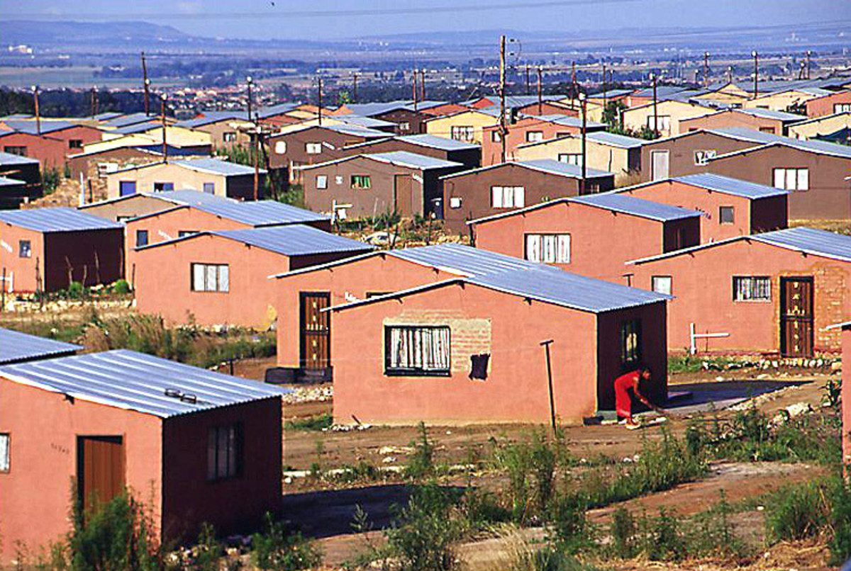 RDP houses that are being built by the ANC in place of shacks; the residents are complaining that the houses are crumbling down on the,