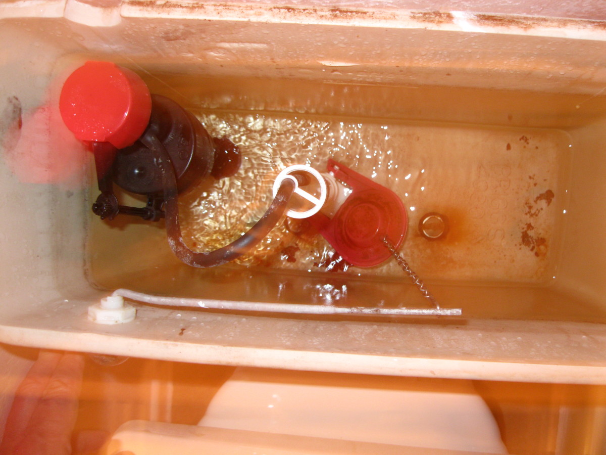 Running water in a toilet tank can usually be fixed by adjusting the chain on the flapper.