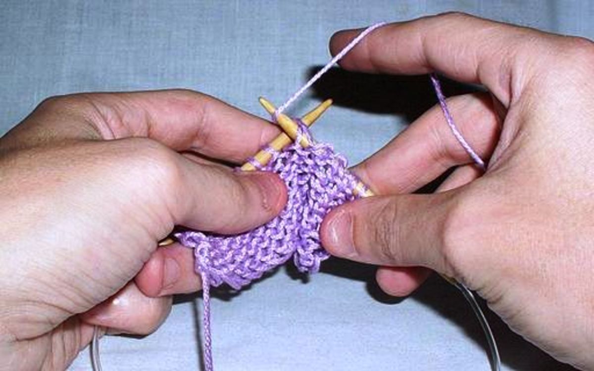 Knitting a stitch.