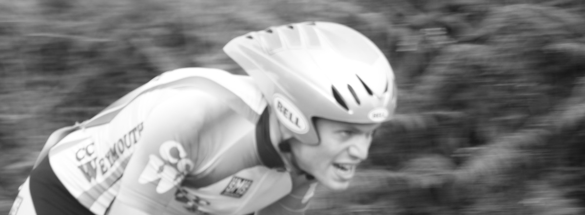A cyclist in a bell aerodynamic cycling helmet during a time trial event