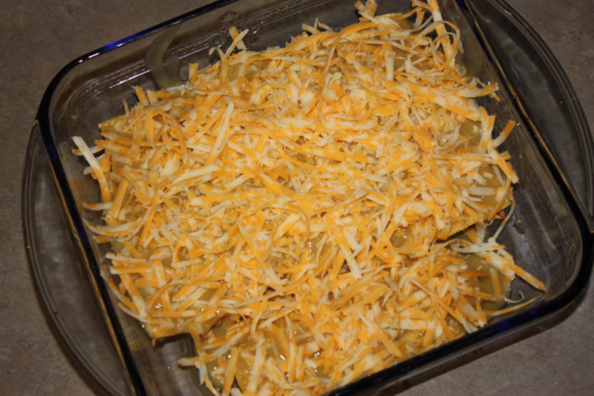 Enchiladas with grated cheese.
