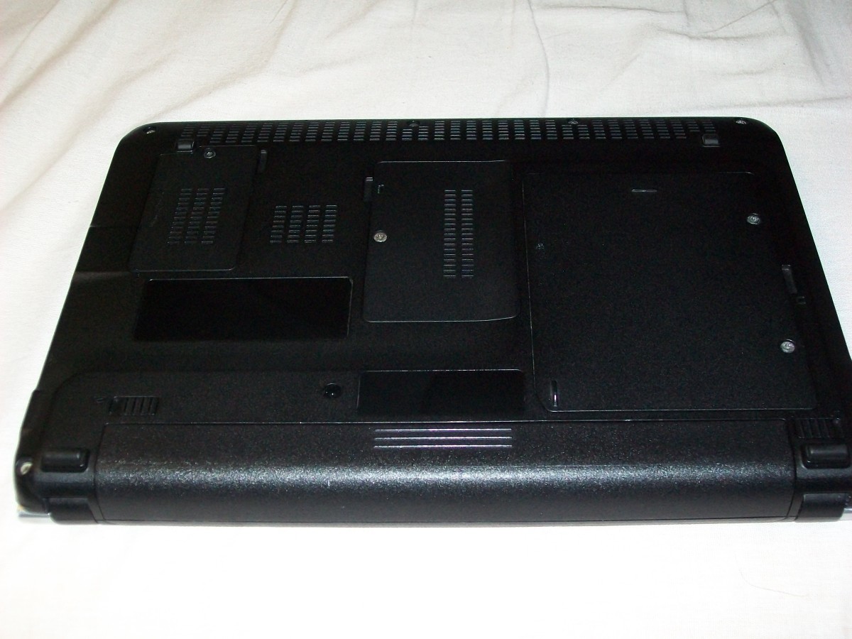 The hard drive is located beneath the large panel on the right of the underside of the netbook