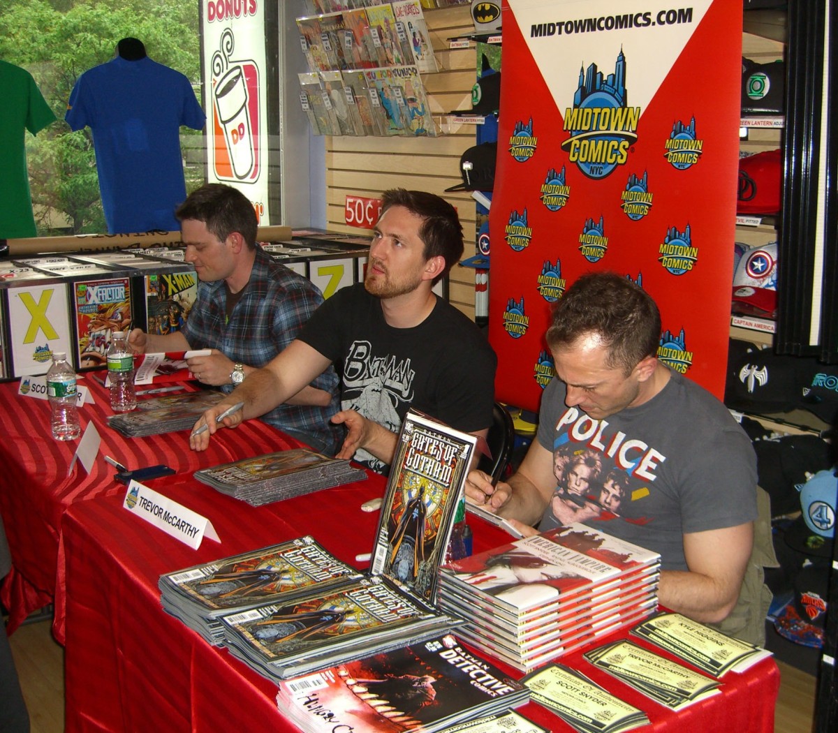 (From left to right) Comics writers Scott Snyder and Kyle Higgins with comics artist Trevor McCarthy at a signing for Batman: Gates of Gotham at Midtown Comics Downtown in Manhattan, May 19, 2011.