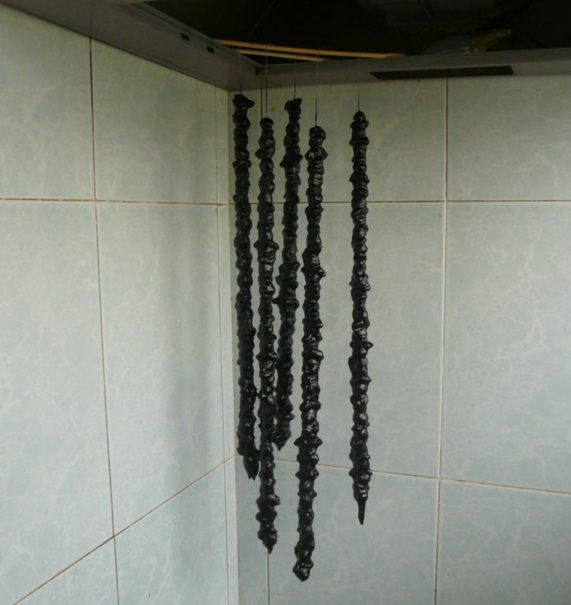 Once chirchkhela stops dripping, hang it somewhere to dry and get ready.