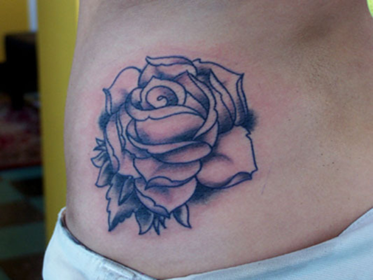 Blue rose tattoo on the outer ankle - Tattoogrid.net
