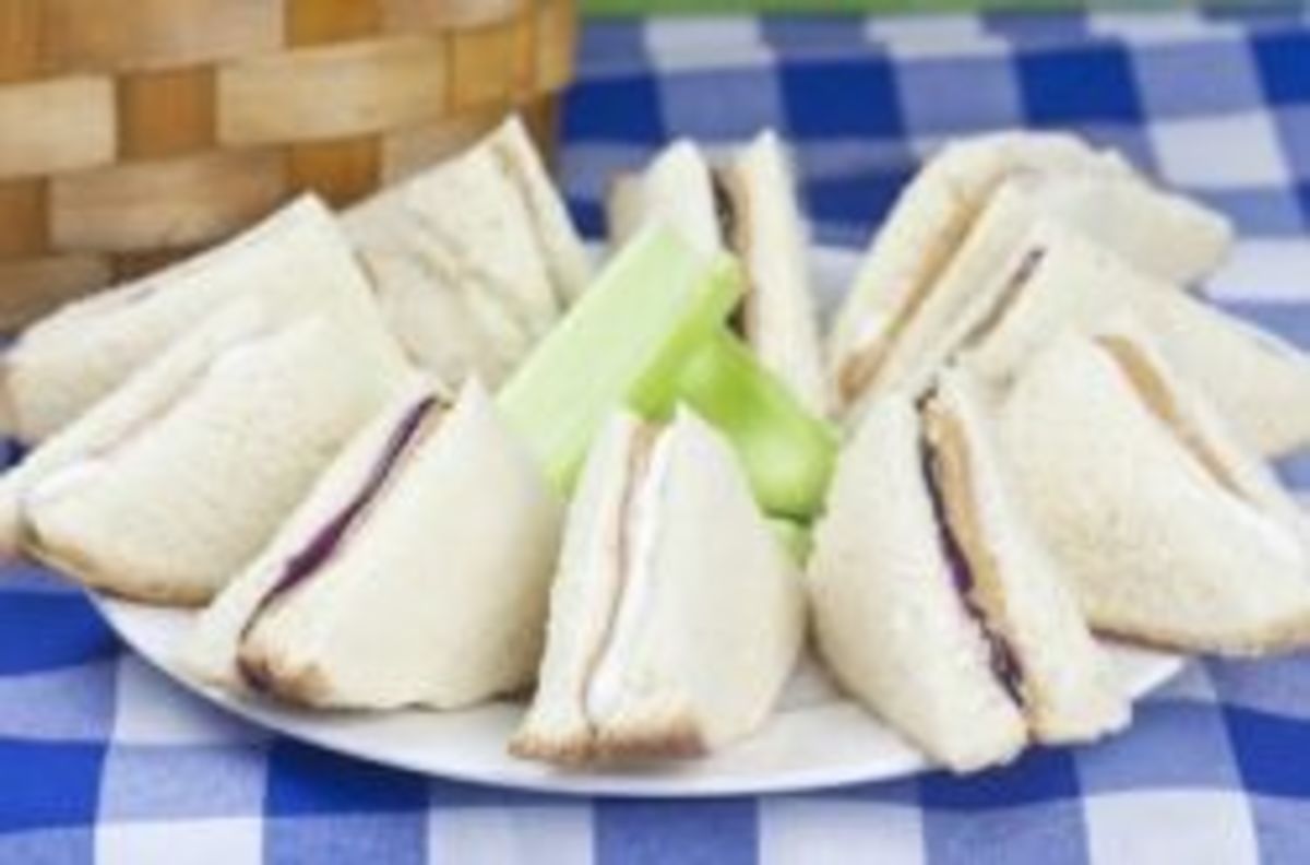 Plant-themed picnic lunch with peanut butter and jelly sandwiches, celery sticks, and more