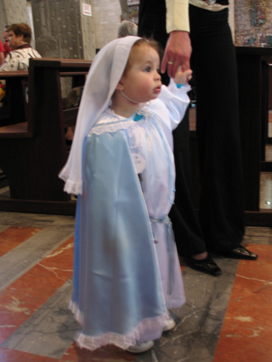 Christians at the Church of the Annunciation in Nazareth. Because May is dedicated to the Virgin Mary, most of the little girls are dressed as Mary. May 1, 2007.
