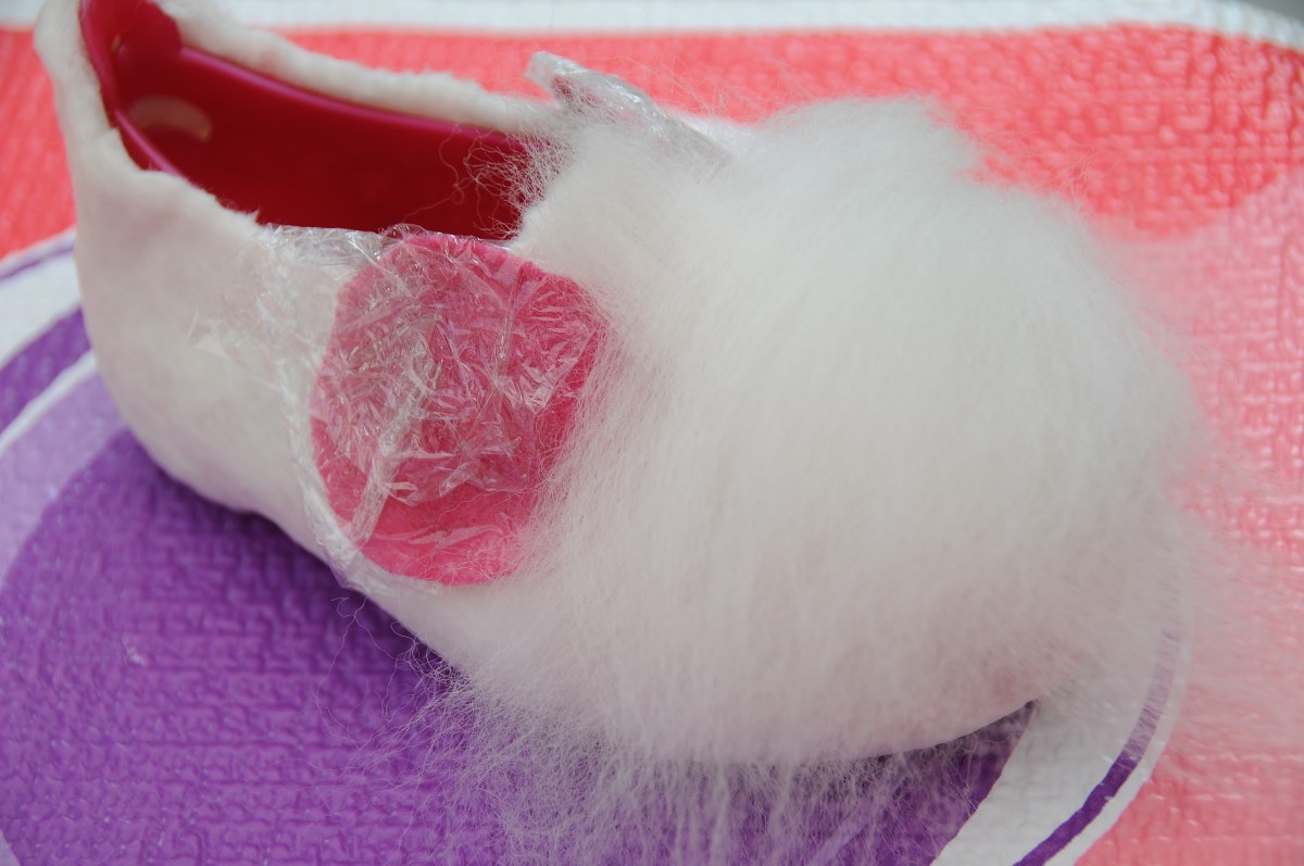 White fibers covering the pink fibers
