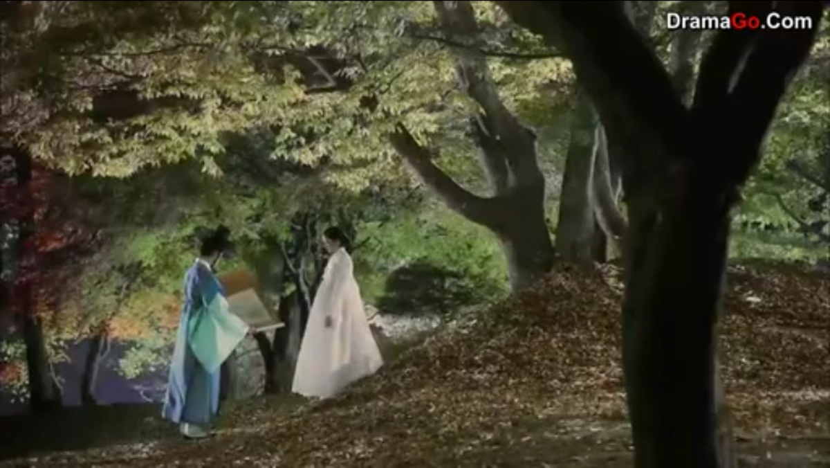 Yi-Hwa and Do Min Joon discussing about a drawing
