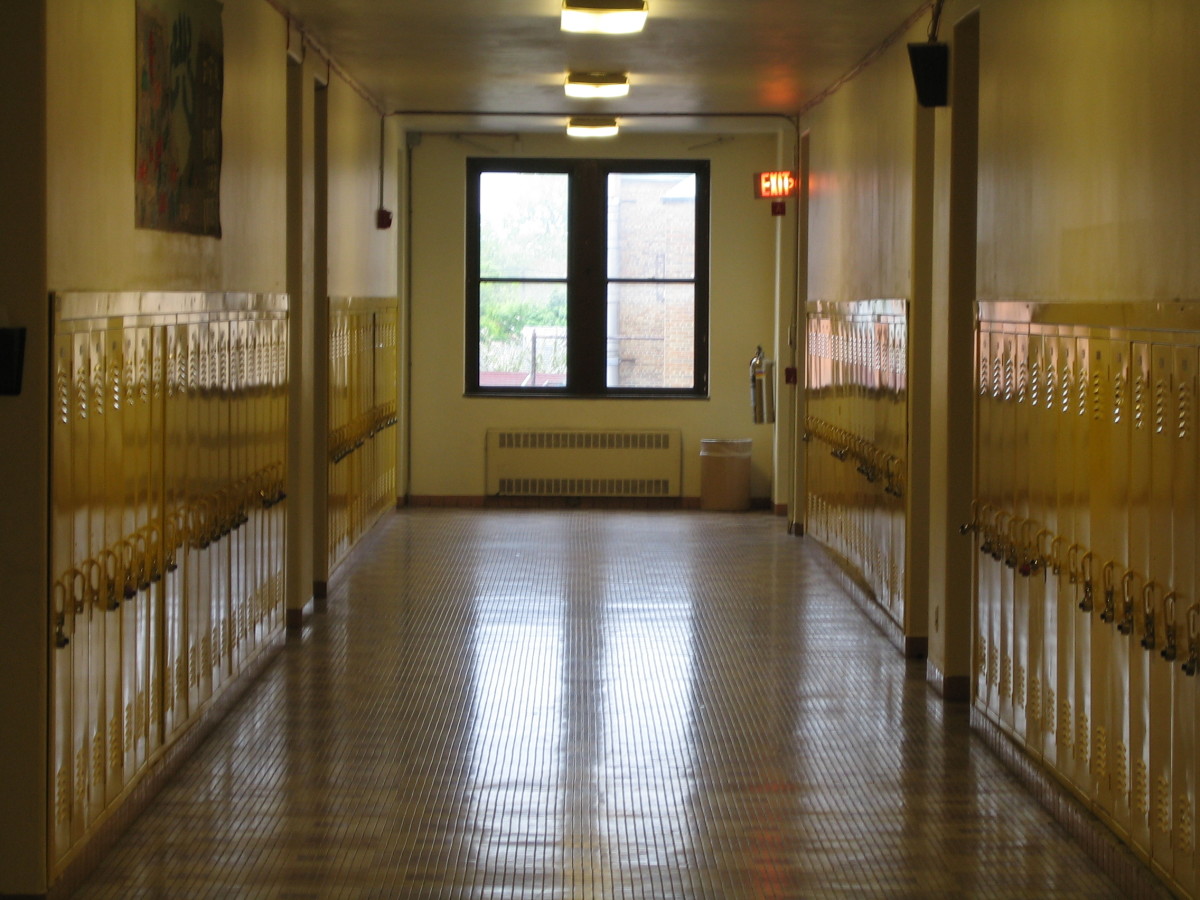 high school hallway with yellow lockers