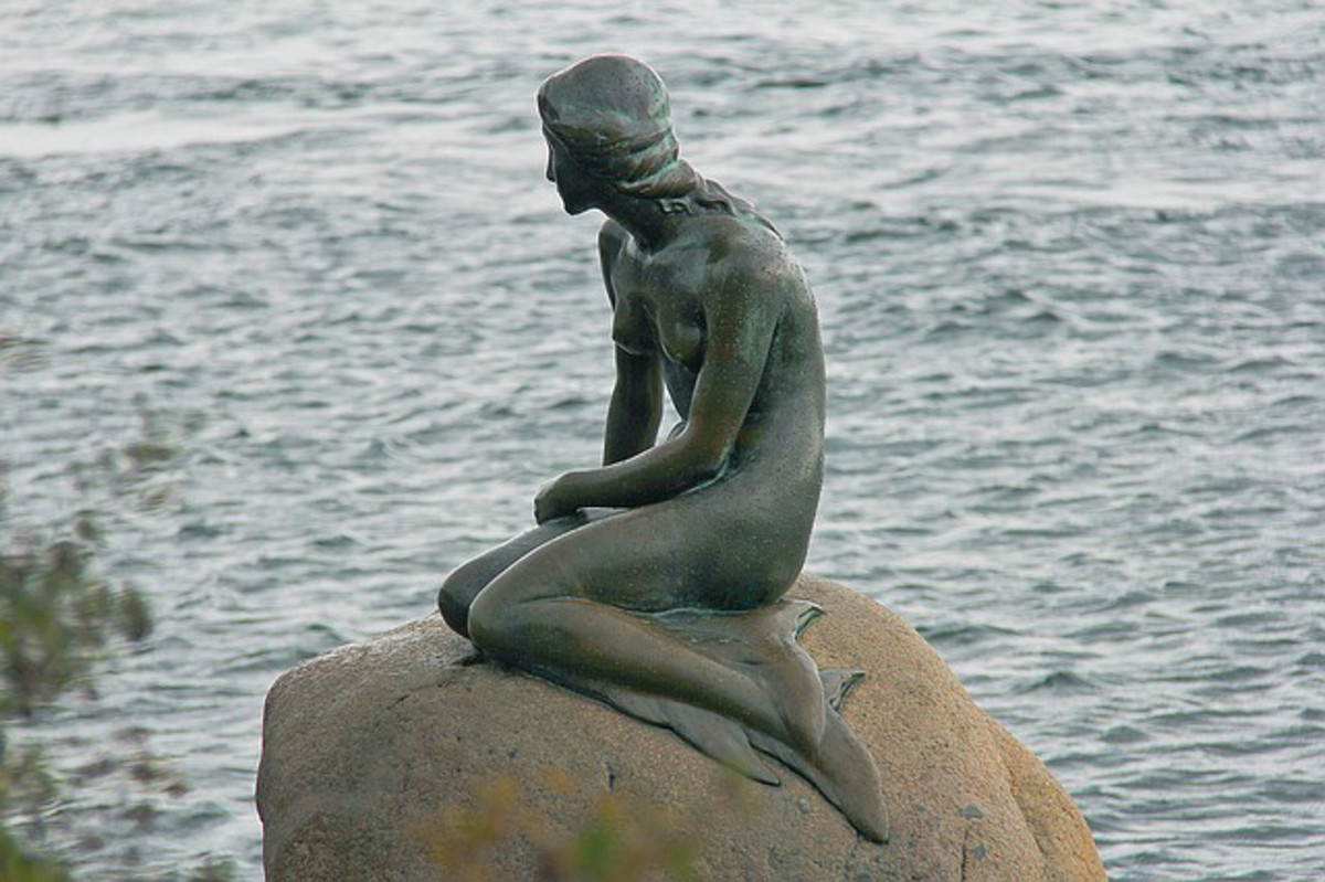 The bronze five-foot statue of the Little Mermaid by Edward Eriksen is located in Copenhagen, Denmark. 