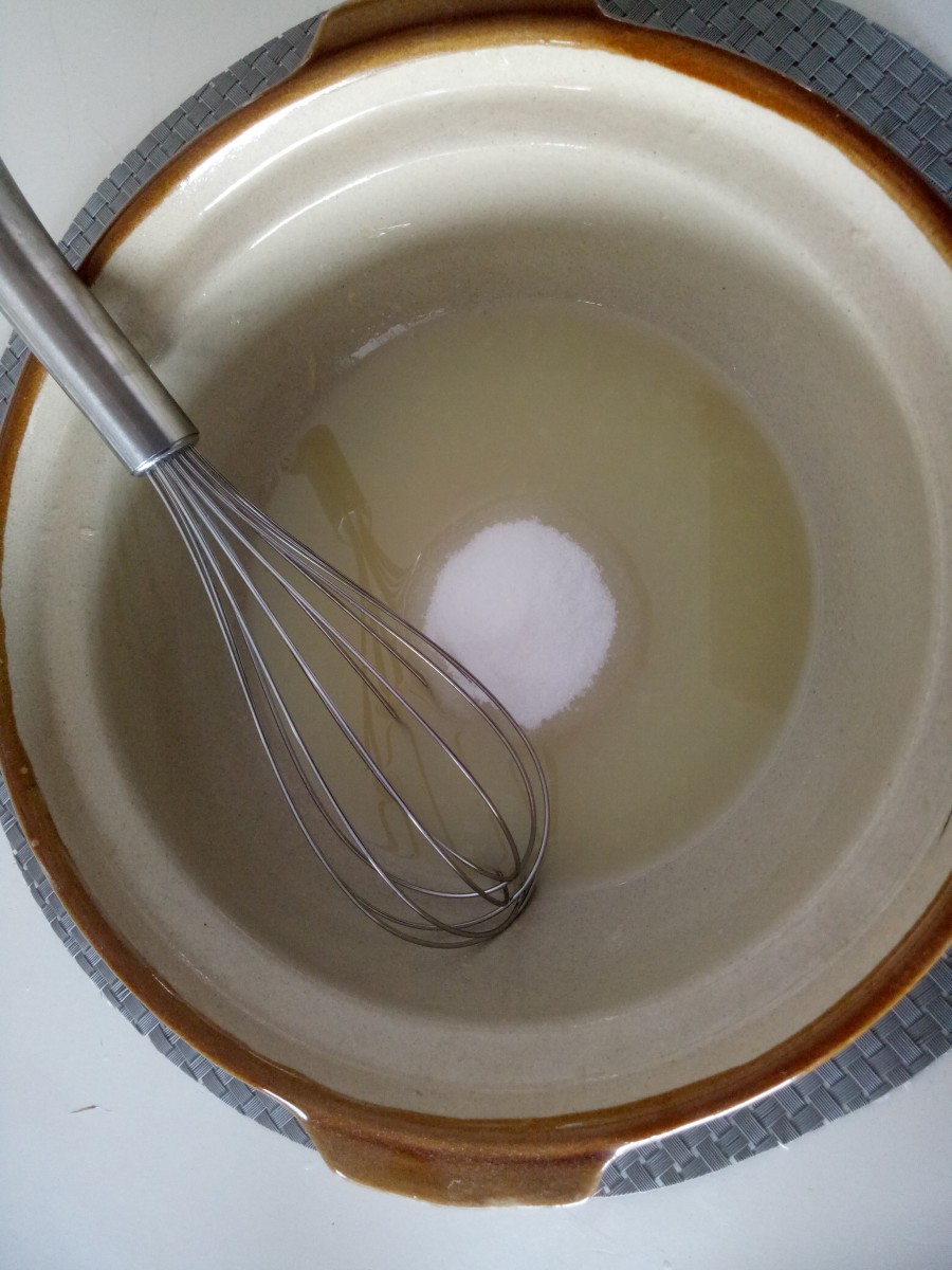 Sugar being whisked into the freshly squeezed juice.