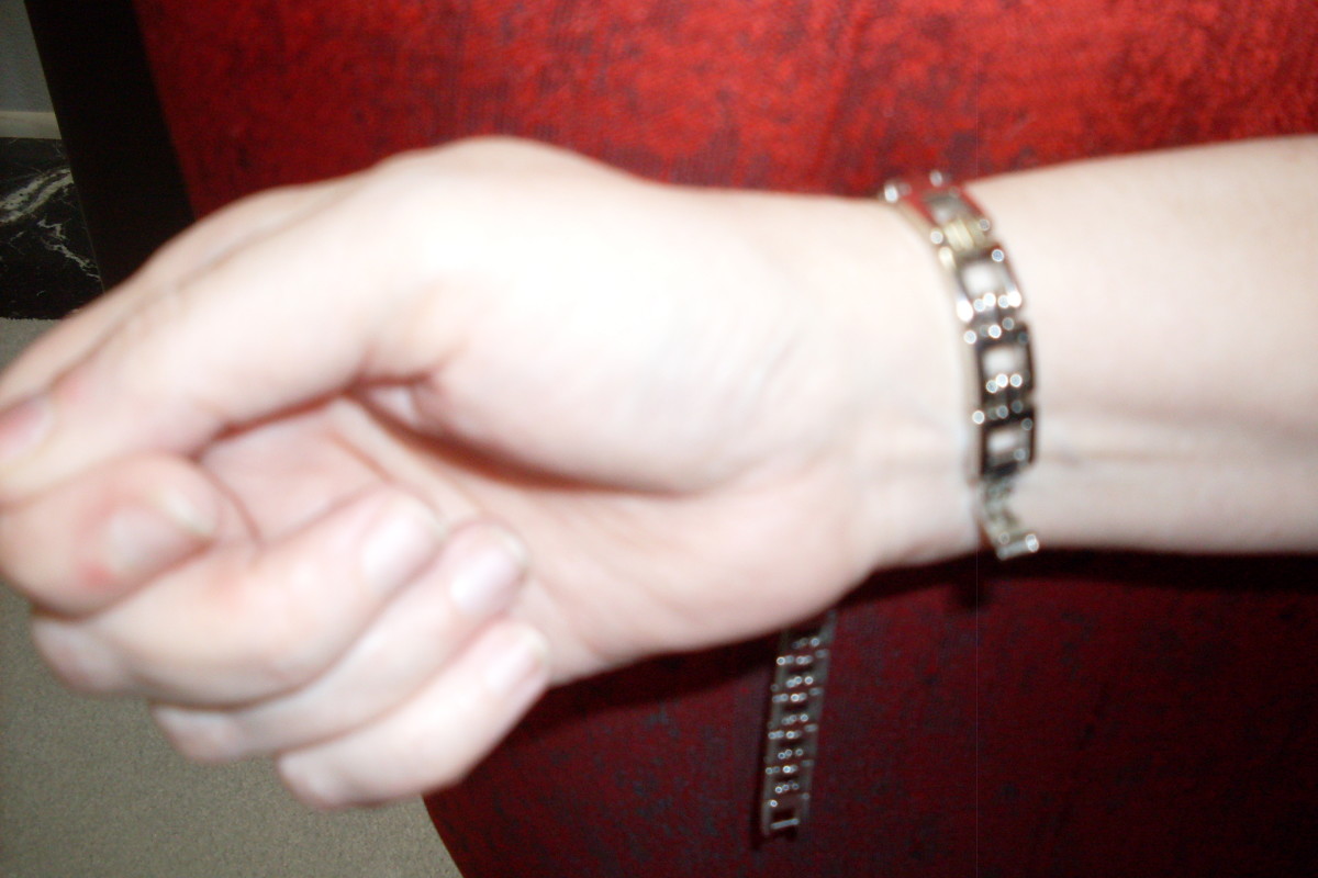 Figure 2. The Bracelet is Laying Loosely Around Your Wrist, Pressed Up Against a Soft Surface Such as Furniture