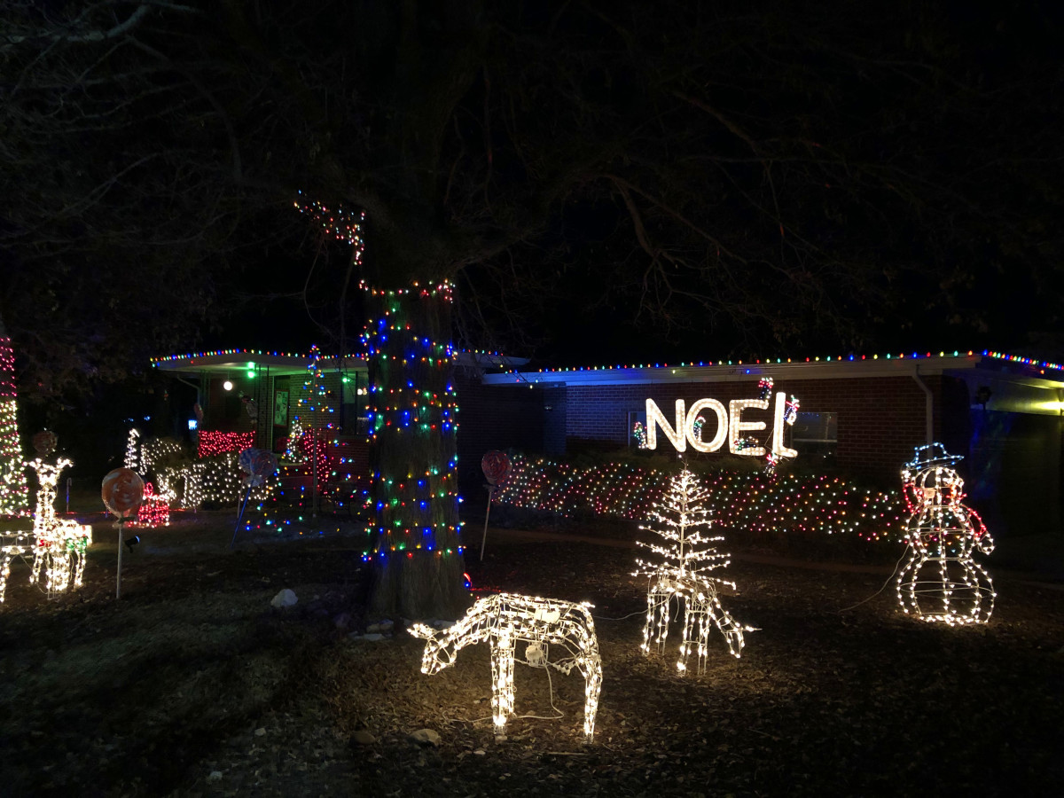 The is one of the more thoroughly -decorated houses on near the intersection of Windermere and Peakview.