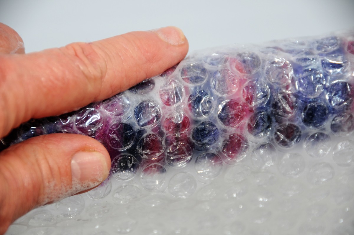 Cover the wet area with bubble-wrap and rub with wet fingers.