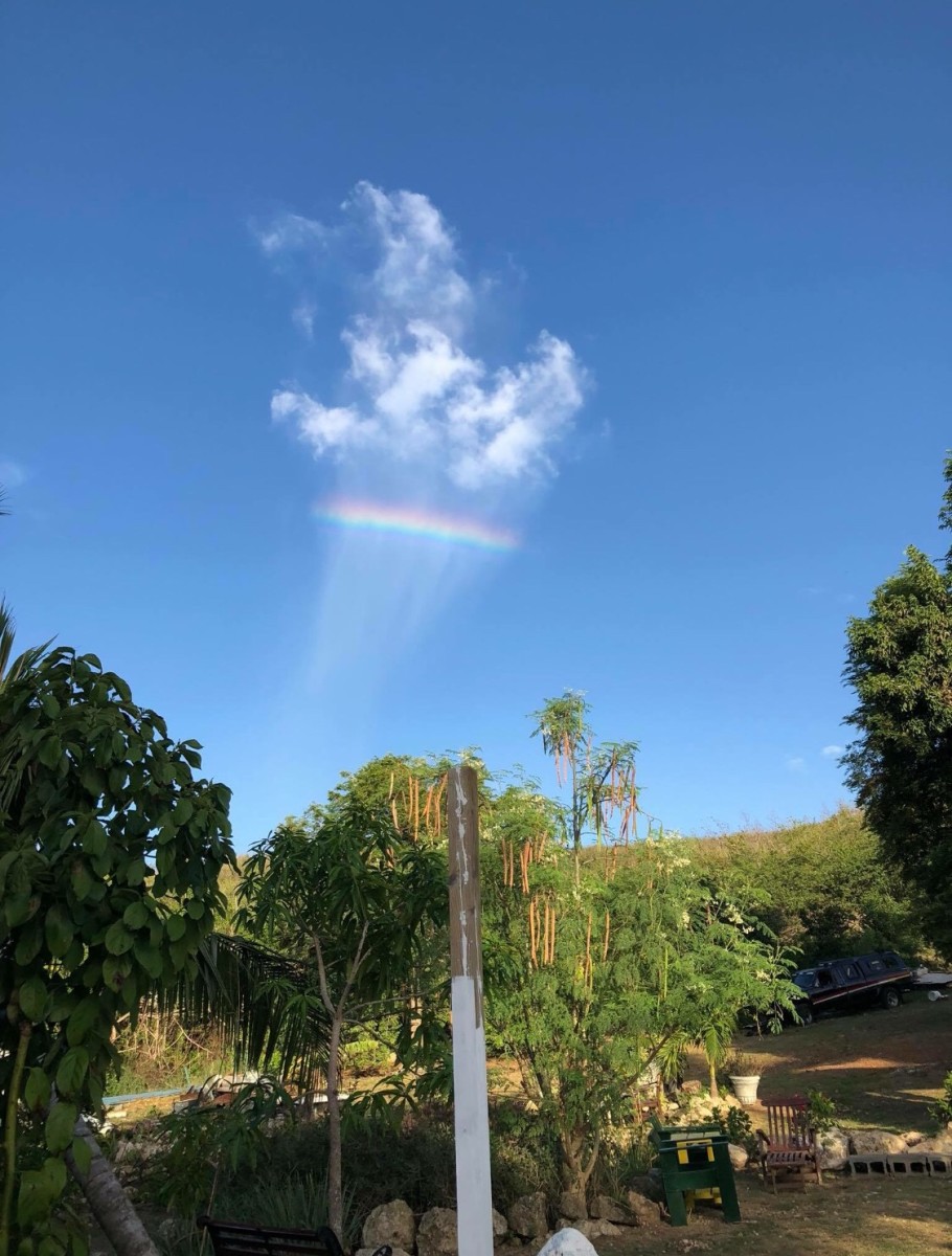 Captured by Senator Terrence Positive Nelson July 31, 2018. A unique appearance in the sky. He was on his property looking over the road heading to Salt River. It was a passing mist & reflection of the sunlight in it's phenomenal view, St. Croix.