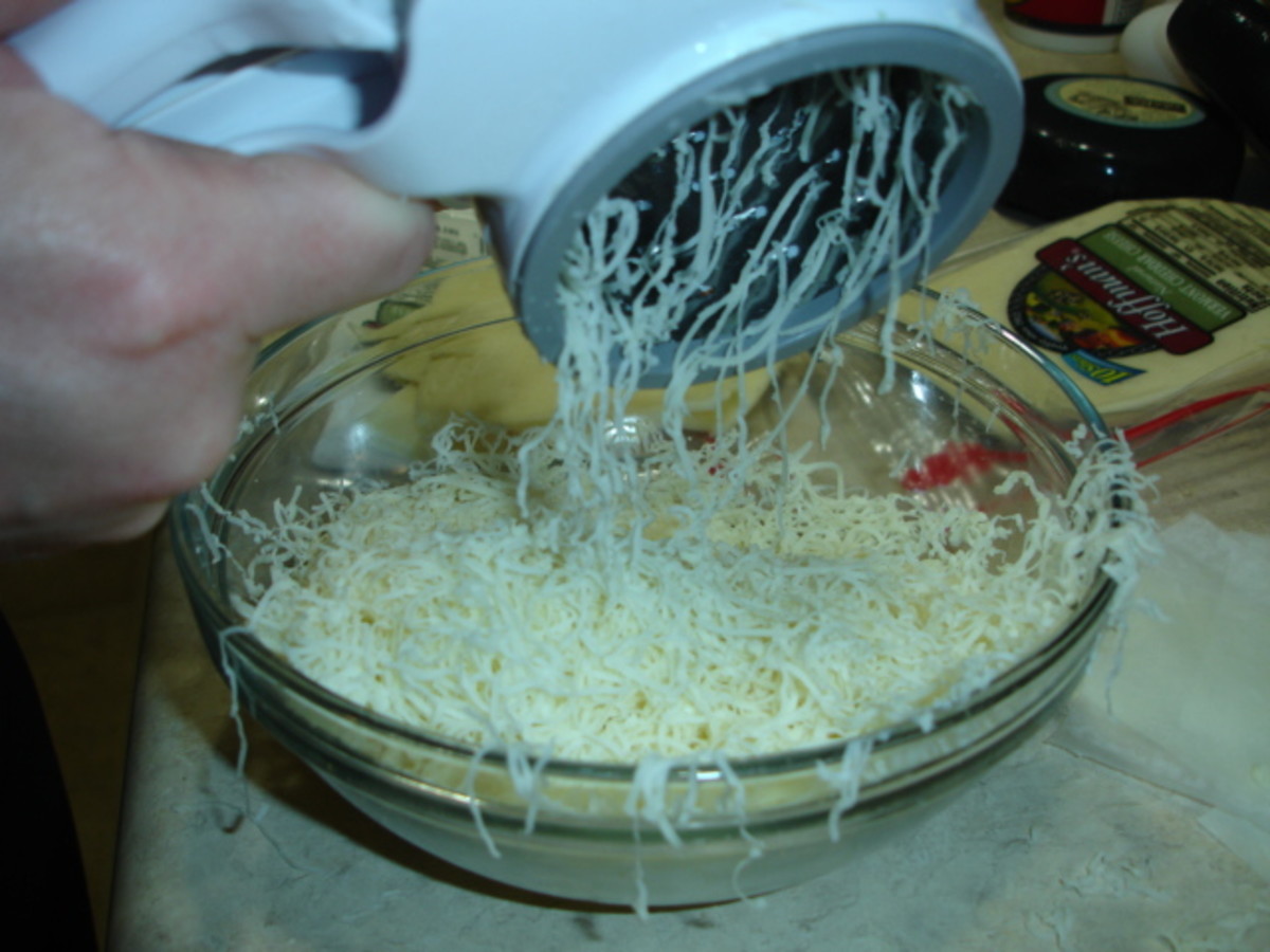 Shredding the cheese for the Cheeecake factory Fried Mac and cheese balls.