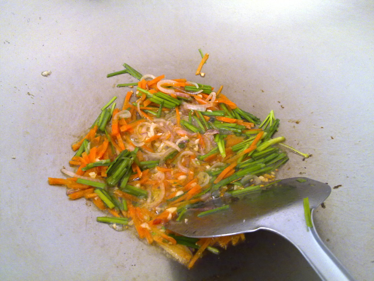 stir fry the garlic, onion, carrots and chives