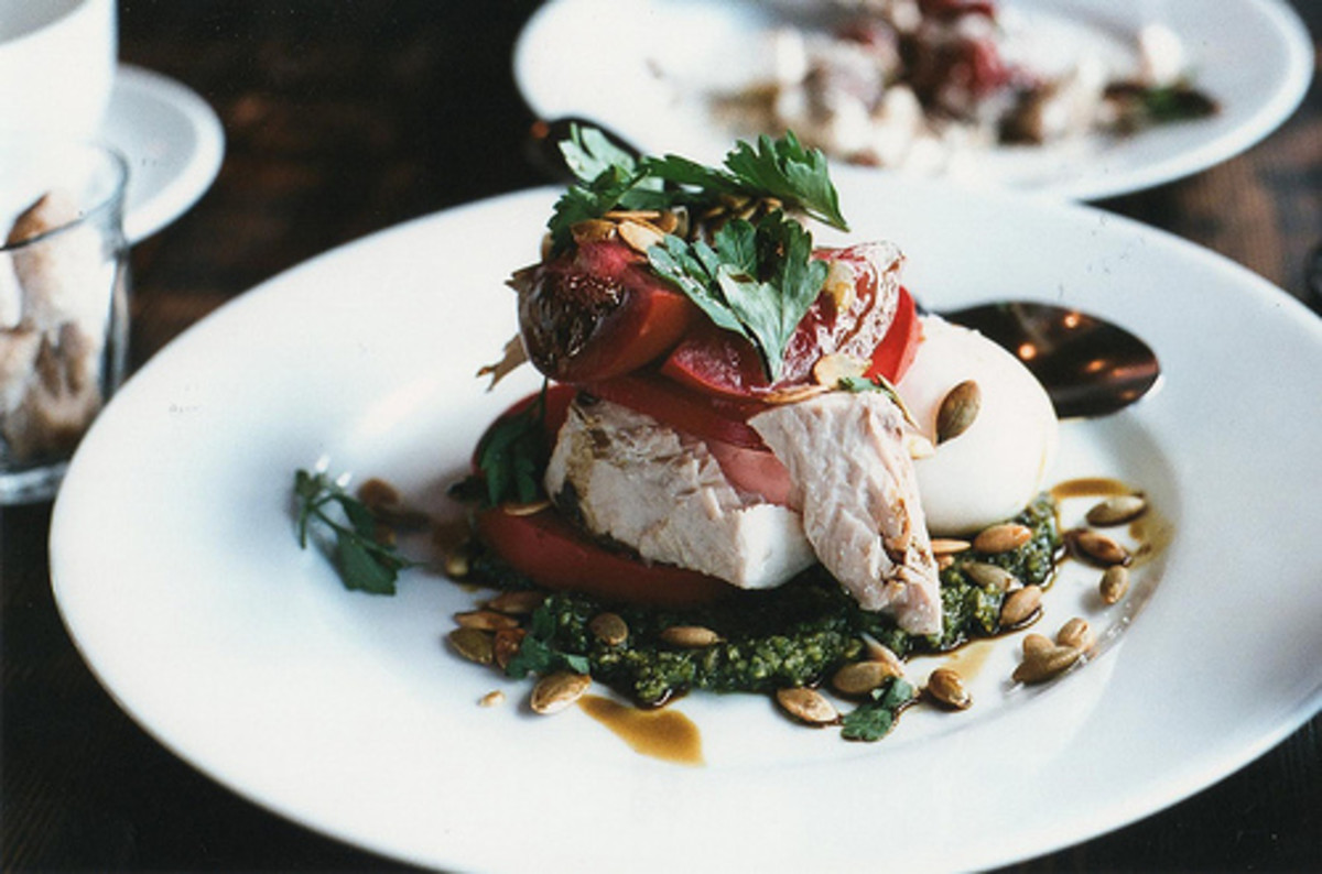 Tuna poached in oil served with pesto and topped with poached egg, heirloom tomatoes, and pumpkin seeds.