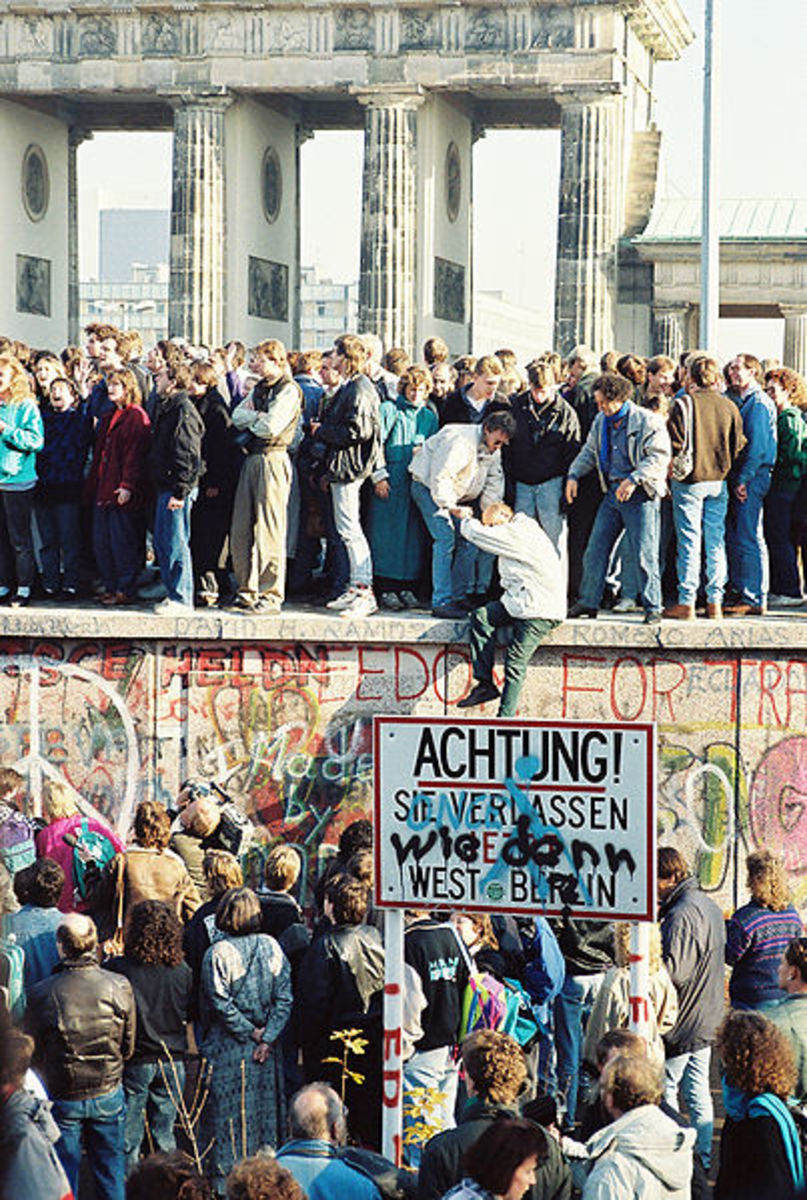 The collapse of the Berlin Wall in 1989 brought about the reunification of Germany. The Allied Powers signed a peace treaty with the resurrected Germany in October 1990, thus marking the official end of World War II.