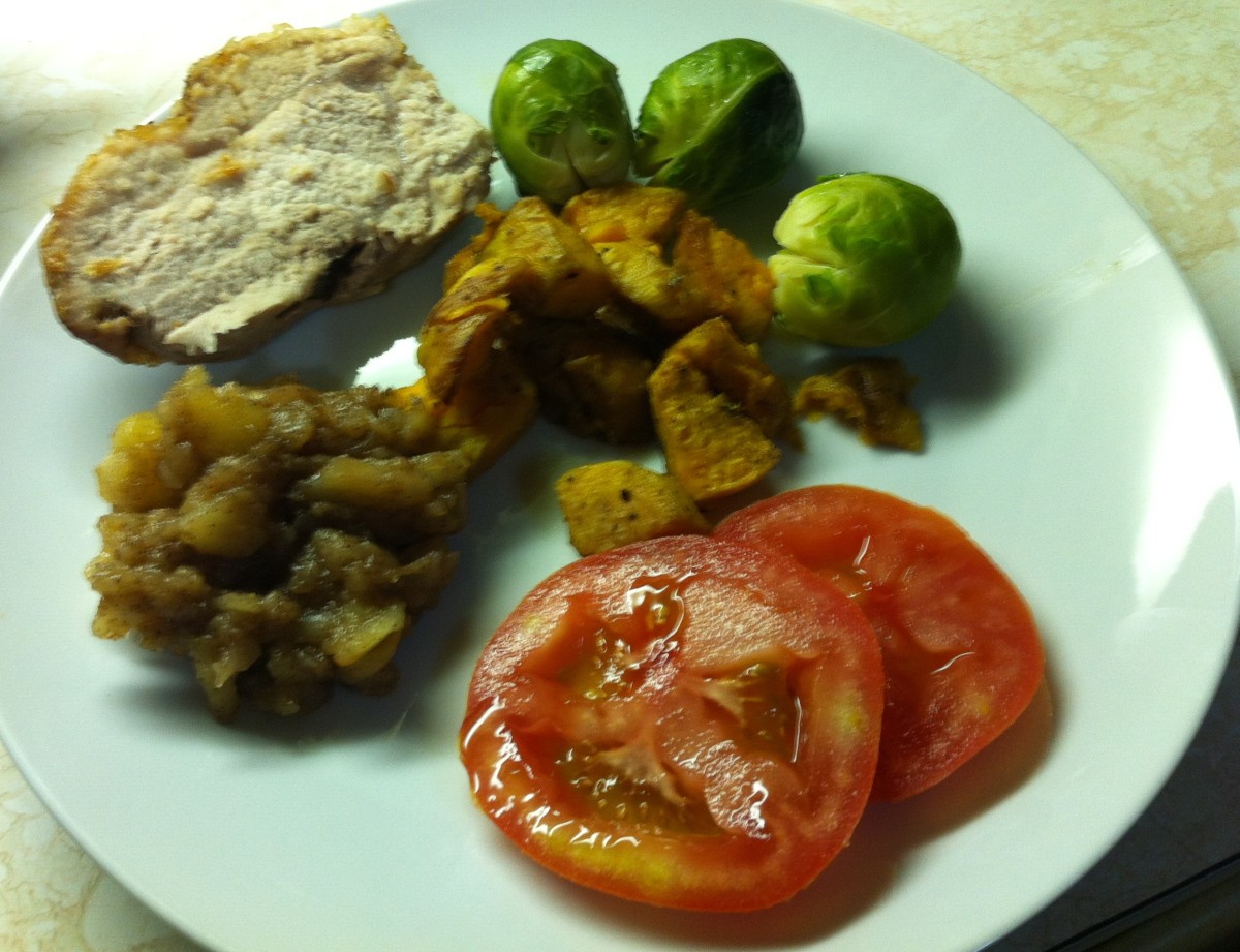 Pork roast with Brussels sprouts, roasted sweet potatoes, sugar free applesauce and sliced tomatoes