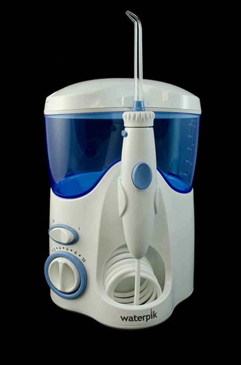 Try using an oral irrigator if your gums are very sensitive